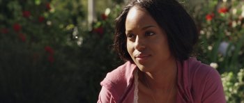 Movie still from “Mother and Child” (2009), directed by Rodrigo García – A person wearing a pink shirt; Close Up shot, Over the shoulder angle