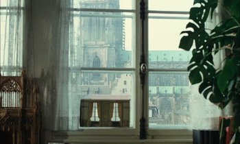 Movie still from “Mr. Klein” (1976), directed by Joseph Losey – A view of a cathedral from a window; Wide shot, Low angle