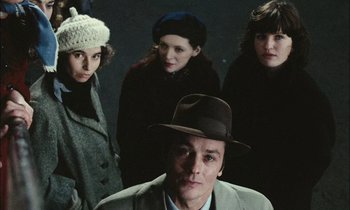 Movie still from “Mr. Klein” (1976), directed by Joseph Losey – A group of people standing next to each other; Medium shot, High angle