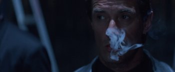 Movie still from “Mr. Nice Guy” (1997), directed by Sammo Kam-Bo Hung – A person smoking a cigarette; Close Up shot, Low angle