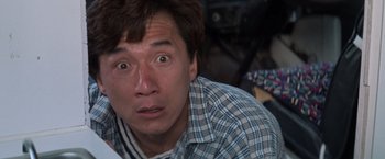 Movie still from “Mr. Nice Guy” (1997), directed by Sammo Kam-Bo Hung – A person with a surprised look on his face; Close Up shot, Low angle