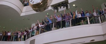 Movie still from “Mr. Nice Guy” (1997), directed by Sammo Kam-Bo Hung – A group of people standing on top of a balcony; Wide shot, Low angle