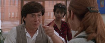 Movie still from “Mr. Nice Guy” (1997), directed by Sammo Kam-Bo Hung – A man and a woman talking to each other in front of a mirror; Close Up shot, Over the shoulder angle