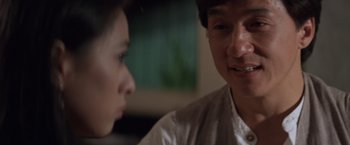 Movie still from “Mr. Nice Guy” (1997), directed by Sammo Kam-Bo Hung – A man and a woman talking to each other; Close Up shot, Over the shoulder angle
