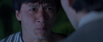 Movie still from “Mr. Nice Guy” (1997), directed by Sammo Kam-Bo Hung – A person looking at the camera; Close Up shot, Over the shoulder angle