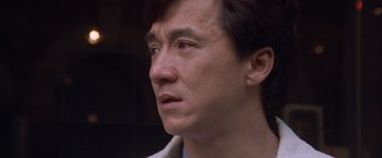 Movie still from “Mr. Nice Guy” (1997), directed by Sammo Kam-Bo Hung – A person looking to his left; Close Up shot, High angle