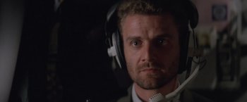 Movie still from “Mr. Nice Guy” (1997), directed by Sammo Kam-Bo Hung – A person wearing headphones; Close Up shot, Low angle