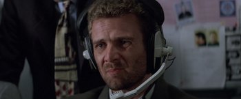 Movie still from “Mr. Nice Guy” (1997), directed by Sammo Kam-Bo Hung – A person wearing a headset; Close Up shot, Low angle