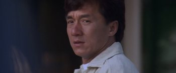Movie still from “Mr. Nice Guy” (1997), directed by Sammo Kam-Bo Hung – A person wearing a white shirt; Close Up shot, Low angle