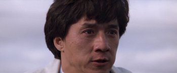 Movie still from “Mr. Nice Guy” (1997), directed by Sammo Kam-Bo Hung – A person wearing a white shirt; Close Up shot, Low angle