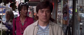 Movie still from “Mr. Nice Guy” (1997), directed by Sammo Kam-Bo Hung – A person walking on the street; Close Up shot, Over the shoulder angle