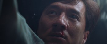 Movie still from “Mr. Nice Guy” (1997), directed by Sammo Kam-Bo Hung – A man's face with blood on his face; Close Up shot, Low angle