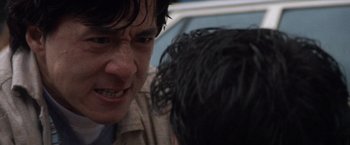 Movie still from “Mr. Nice Guy” (1997), directed by Sammo Kam-Bo Hung – A person talking to another person; Close Up shot, Over the shoulder angle