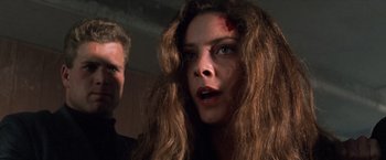 Movie still from “Mr. Nice Guy” (1997), directed by Sammo Kam-Bo Hung – A person with blood on her face; Close Up shot, Over the shoulder angle