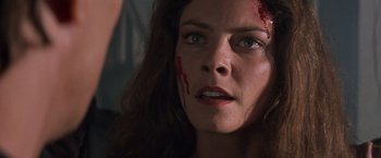 Movie still from “Mr. Nice Guy” (1997), directed by Sammo Kam-Bo Hung – A person with blood on her face; Close Up shot, Over the shoulder angle