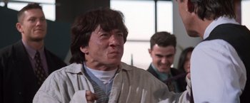 Movie still from “Mr. Nice Guy” (1997), directed by Sammo Kam-Bo Hung – A man with a red nose is standing next to another man; Close Up shot, Low angle