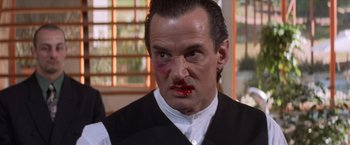 Movie still from “Mr. Nice Guy” (1997), directed by Sammo Kam-Bo Hung – A person with blood on his face; Close Up shot, Low angle