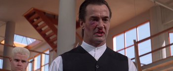 Movie still from “Mr. Nice Guy” (1997), directed by Sammo Kam-Bo Hung – A person wearing a shirt and tie; Close Up shot, Low angle