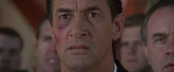 Movie still from “Mr. Nice Guy” (1997), directed by Sammo Kam-Bo Hung – A person with a bruise on his face; Close Up shot, Low angle