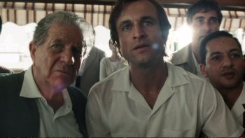 Movie still from “Munich” (2005), directed by Steven Spielberg – A man and an older man are looking at the camera; Close Up shot, Low angle