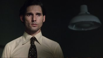 Movie still from “Munich” (2005), directed by Steven Spielberg – A man in a white shirt and a brown tie; Close Up shot, Low angle