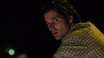 Movie still from “Munich” (2005), directed by Steven Spielberg – A person wearing a scarf; Close Up shot, Low angle