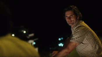 Movie still from “Munich” (2005), directed by Steven Spielberg – A person wearing a shirt; Medium shot, Over the shoulder angle