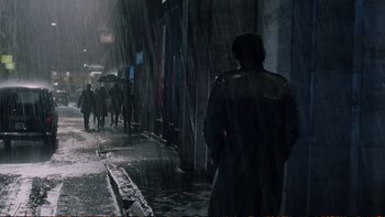 Movie still from “Munich” (2005), directed by Steven Spielberg – People walking down the street in the rain on a rainy night; Wide shot, High angle