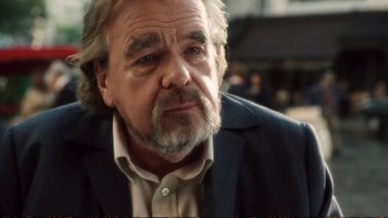 Movie still from “Munich” (2005), directed by Steven Spielberg – An older man with a gray beard looking at the camera; Close Up shot, Over the shoulder angle
