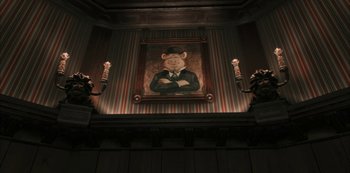 Movie still from “Muppets Haunted Mansion” (2021), directed by Kirk R. Thatcher – A painting of a man in a suit hanging on the wall; Medium shot, Low angle