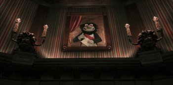 Movie still from “Muppets Haunted Mansion” (2021), directed by Kirk R. Thatcher – A painting of a monkey hanging on the wall of a room; Wide shot, Low angle