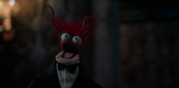 Movie still from “Muppets Haunted Mansion” (2021), directed by Kirk R. Thatcher – The head of a muppet doll; Extreme Close Up shot, High angle