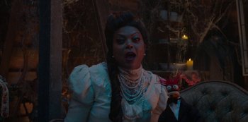 Movie still from “Muppets Haunted Mansion” (2021), directed by Kirk R. Thatcher – A woman in a white dress holding a stuffed animal; Medium shot, Over the shoulder angle