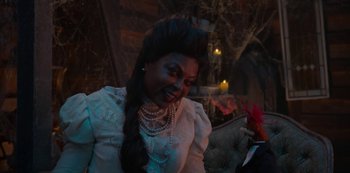 Movie still from “Muppets Haunted Mansion” (2021), directed by Kirk R. Thatcher – A woman with long black hair wearing a white dress; Close Up shot, Over the shoulder angle