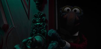 Movie still from “Muppets Haunted Mansion” (2021), directed by Kirk R. Thatcher – The head of a muppet character; Close Up shot, Over the shoulder angle