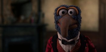 Movie still from “Muppets Haunted Mansion” (2021), directed by Kirk R. Thatcher – The head of a muppet character; Close Up shot, Over the shoulder angle