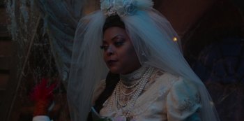 Movie still from “Muppets Haunted Mansion” (2021), directed by Kirk R. Thatcher – A woman wearing a wedding dress and a veil; Close Up shot, Over the shoulder angle