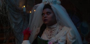 Movie still from “Muppets Haunted Mansion” (2021), directed by Kirk R. Thatcher – A woman in a wedding dress and veil holding a bouquet of flowers; Close Up shot, Over the shoulder angle