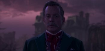 Movie still from “Muppets Haunted Mansion” (2021), directed by Kirk R. Thatcher – A man in a suit and a red neck tie; Close Up shot, Low angle