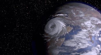 Movie still from “Muppets from Space” (1999), directed by Tim Hill – A satellite image of the earth with a hurricane in it's center; Extreme Wide shot, Overhead angle