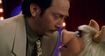 Movie still from “Muppets from Space” (1999), directed by Tim Hill – A man and a woman looking at one another's eyes; Close Up shot, Over the shoulder angle