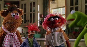 Movie still from “Muppets from Space” (1999), directed by Tim Hill – A couple of stuffed animals that are next to each other; Medium shot, Low angle