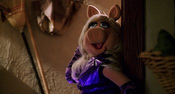 Movie still from “Muppets from Space” (1999), directed by Tim Hill – The head of a muppet character , miss piggy; Close Up shot, High angle