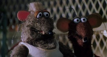 Movie still from “Muppets from Space” (1999), directed by Tim Hill – A couple of stuffed animals that are next to each other; Close Up shot, Low angle