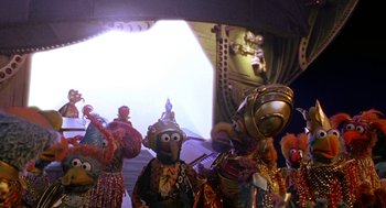 Movie still from “Muppets from Space” (1999), directed by Tim Hill – A group of muppets dressed up in costumes; Wide shot, Low angle