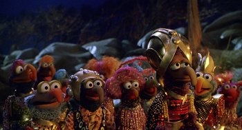 Movie still from “Muppets from Space” (1999), directed by Tim Hill – A group of muppets dressed up in costumes and hats; Medium shot, Low angle