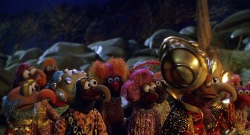 Movie still from “Muppets from Space” (1999), directed by Tim Hill – A group of stuffed animals are gathered together; Extreme Wide shot, High angle