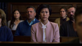Movie still from “13 Reasons Why” (2017), created by Brian Yorkey – A group of people sitting in a court room; Medium shot, Over the shoulder angle