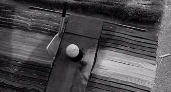 Movie still from “Murder by Contract” (1958), directed by Irving Lerner – A golf ball on a tee; Extreme Close Up shot, Overhead angle
