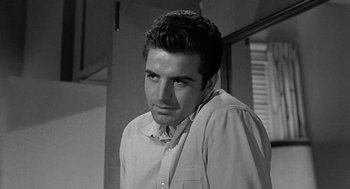 Movie still from “Murder by Contract” (1958), directed by Irving Lerner – Black and white photograph of a man in a dress shirt; Close Up shot, Over the shoulder angle